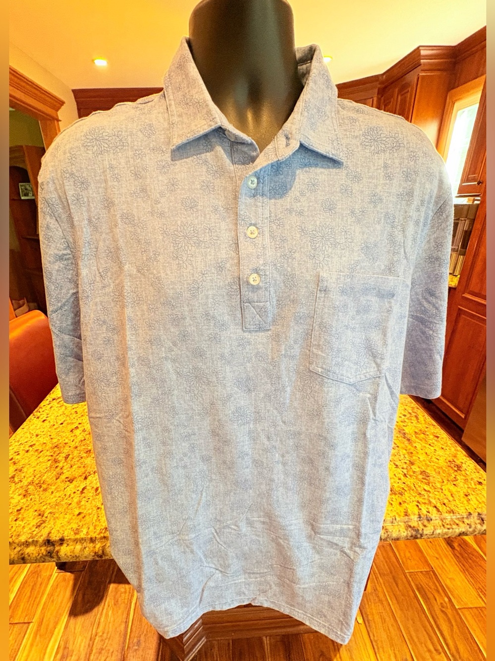 johnnie-O men’s golf polo. Subtle Floral‎ print with logo.